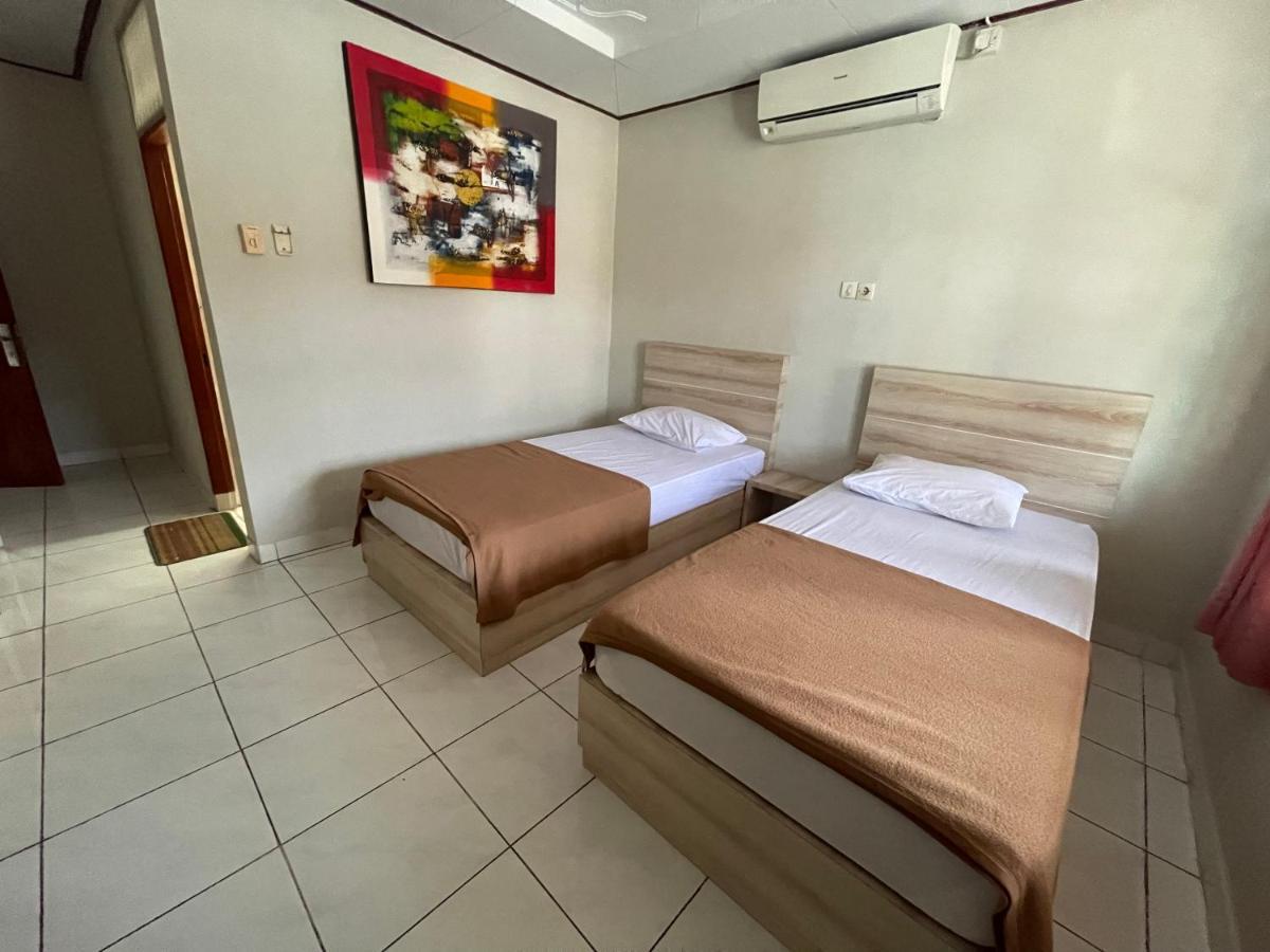 Отель Palm Garden Kuta Кута Экстерьер фото