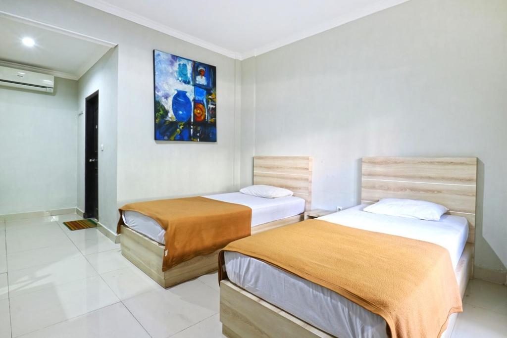 Отель Palm Garden Kuta Кута Экстерьер фото