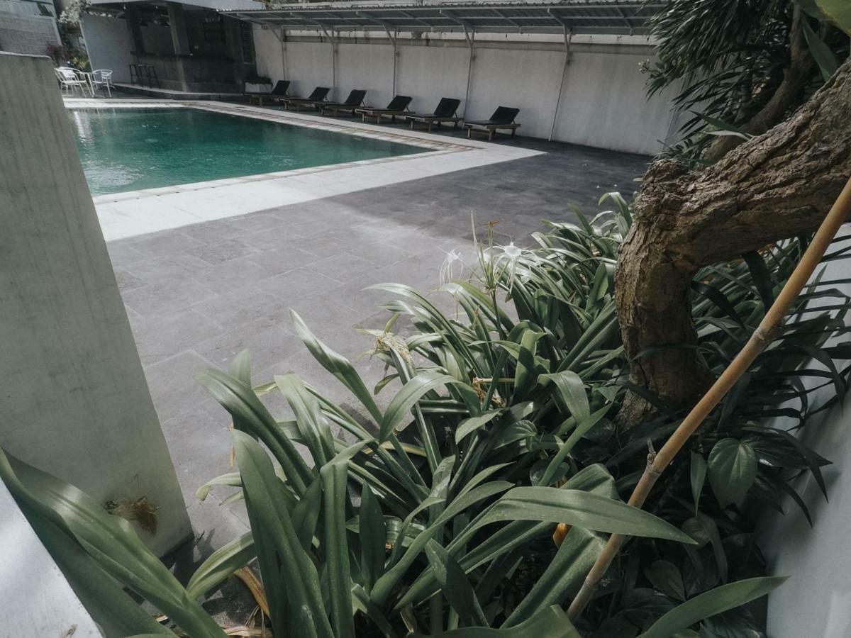 Отель Palm Garden Kuta Кута Экстерьер фото